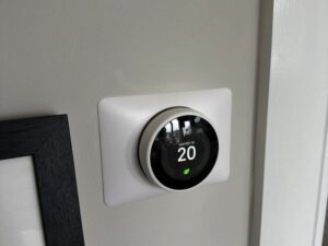 smart thermostat on wall modern UK home