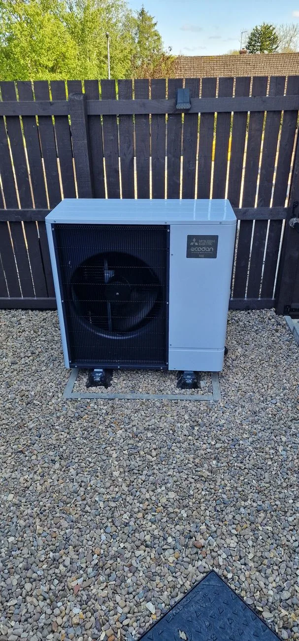 Mitsubishi Ecodan air source heat pump installed outside Josh's home